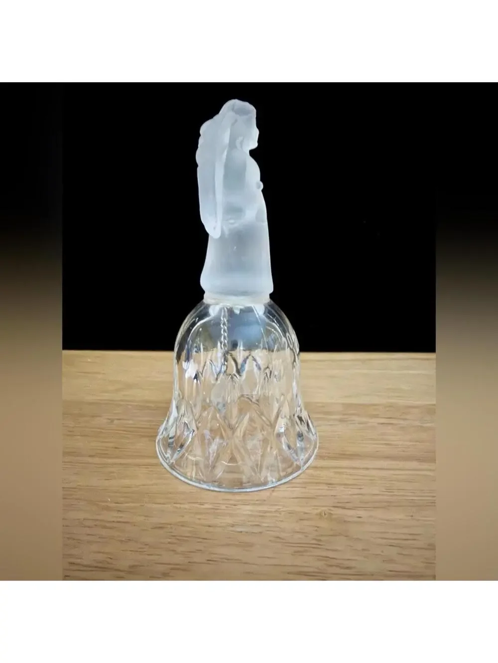 vintage frosted angel sits atop a crystal bell etched with the year 2001.